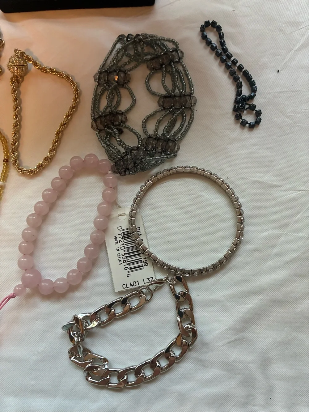 33 Vintage and modern bracelets. Some are stretchy and some aren’t.